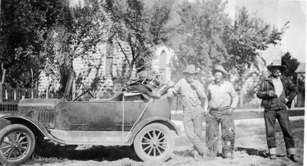 unidentified cowboys who may have been going to a rodeo with a car loaded with their saddles